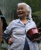 A woman shares a laugh while offering some candy in the mountains on the island of Kyushu, Japan.