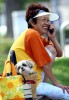 A woman chats on the phone while her dog sits patiently in a hand basket in the city of Hakodate, on the northern island of Hokkaido in Japan.