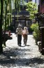 A couple tours the side-streets of Gujo-Hachiman, in Honshu.