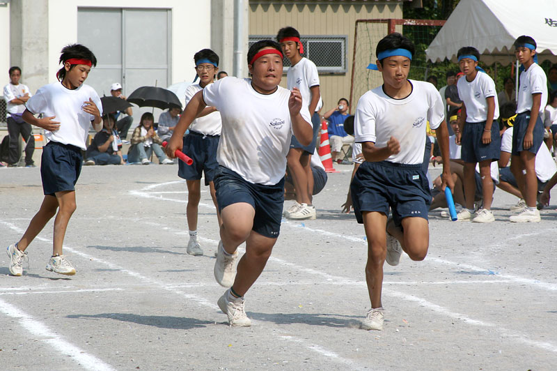 School kids run the 400 metre relay, the final event of sports day, in Sakawa, Shikoku. The kids train for months for the one day emotionally charged event.