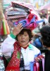 A woman balances her goods as she tries to make a sale in a street market in Haeundae-gu, Busan, South Korea.