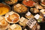 Dishes of replica food sit on display at a restaurant in a market in Seoul. The dishes represent menu items and pricing as to what is available in the restaurant.