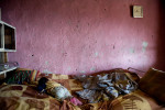 Two infants sleep in a dilapidated home in a Roma community.  Habitat for Humanity Bulgaria provides loans to families in the area, enabling them to rehabilitate their apartments.© Habitat for Humanity International/Ezra Millstein