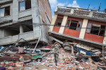 KATHMANDU, NEPAL (4/27/15)-A Nepali recovery team prepares to remove a dead body from a collapsed building, two days after a huge 7.8-magnitude earthquake struck Nepal, and was felt as far as India and Pakistan.  © Habitat for Humanity International/Ezra Millstein