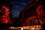 Al Khazneh, or the Treasury, was carved out of a sandstone rock face. It is one of the most elaborate temples in Petra, and is otherworldly at night. 