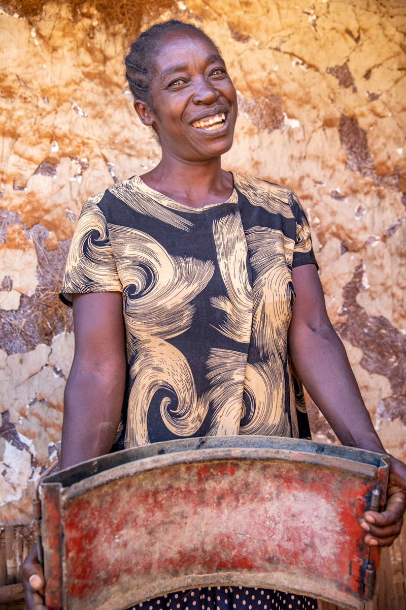 Aselefech, 32, holds a mold used to make cookstoves. Mercy Corps trained her to build clean cookstoves alongside three other mothers and provided support to put her kids through school. In Gidole, Mercy Corps is helping promote girls’ education by supporting women and children through the PEG program. The students receive support to finish their education, and their mothers receive job skills training and small business support. 
