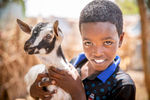 Samatan, 10, holds a goat in front of his family's house. His mother Safiya, 45, is a community leader in Hartasheik, Ethiopia. Mercy Corps trained her and several others in her community to help change dangerous traditional behaviors about women’s health and natural resource management. Now the community is connected to health services and protecting the vital land that provides for them.“Women should take leadership roles, and I feel comfortable doing it,” she says. “It’s obvious that women are taking the lead in Ethiopia. The leadership is there and women are taking hold of it.”