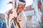 Farhan, 12, holds a goat in front of his family's house. His mother Safiya, 45, is a community leader in Hartasheik, Ethiopia. Mercy Corps trained her and several others in her community to help change dangerous traditional behaviors about women’s health and natural resource management. Now the community is connected to health services and protecting the vital land that provides for them.“Women should take leadership roles, and I feel comfortable doing it,” she says. “It’s obvious that women are taking the lead in Ethiopia. The leadership is there and women are taking hold of it.”