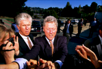 Photo of President Clinton (while he was President), flanked by Secret Service Agents as he greets bystanders near San Francisco. (for Business Week magazine)