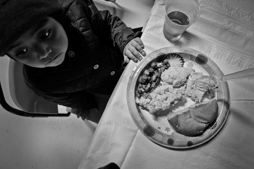Free Thanksgiving Day meal at a local church. Yunghi Kim ©2014.