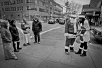 12,11,2015 NY Neighborhood profiles series.  Jackson Heights Queens.  Two dressed for SantaCon passed through 74 th Street. © 2015 Yunghi Kim/Contact Press Images.