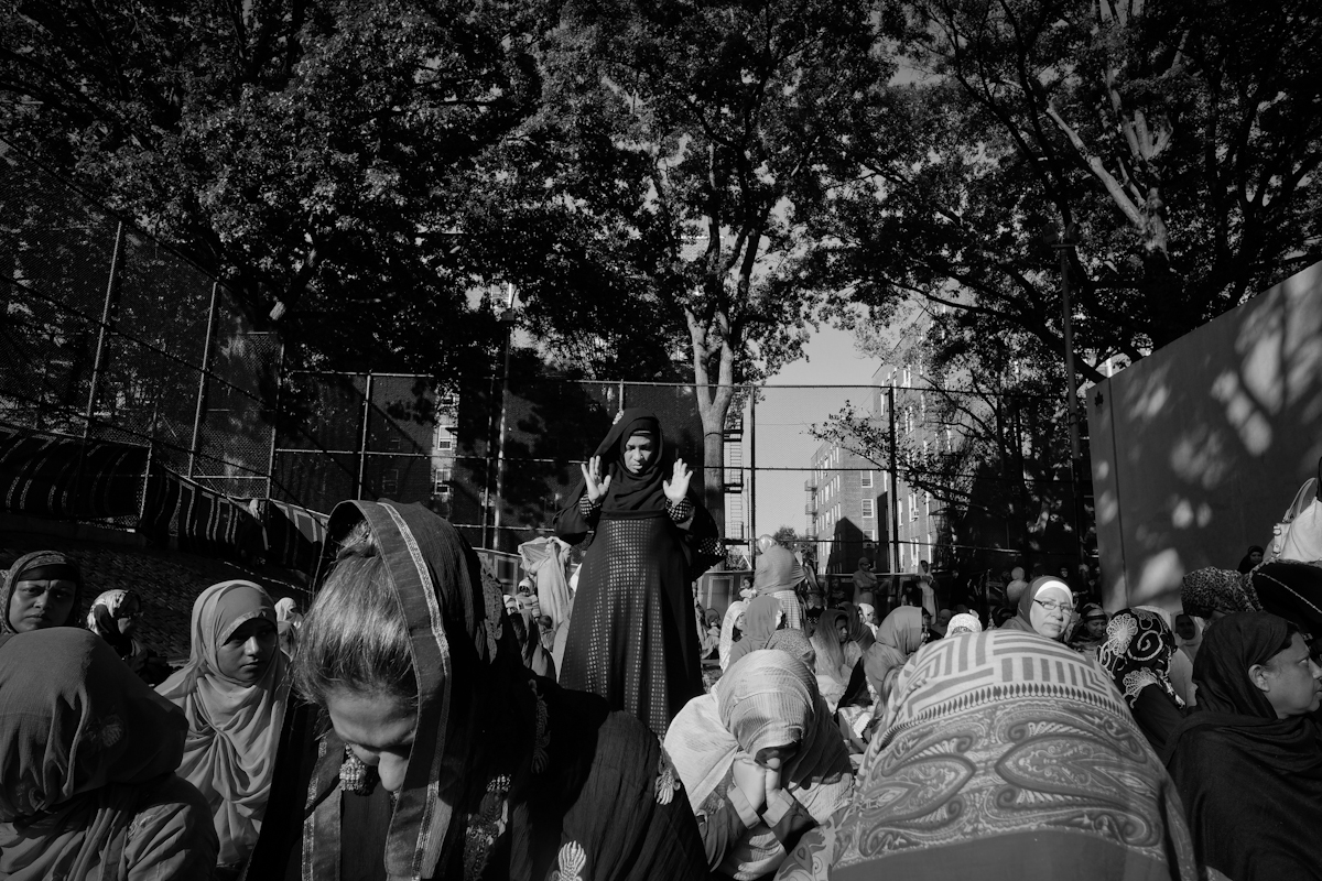 9/24/15 NY Neighborhood profiles series.  Jackson Heights Queens. Travers Park, morning Eid prayer. Women section is a handball court. © 2015 Yunghi Kim/Contact Press Images.