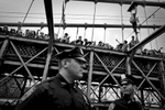 Anticipation of impending mass arrests on Brooklyn Bridge NYC, protesters climbed to the upper level of the bridge to avoid arrest. 700 were arrested including many journalists. Anyone who stayed on the bridge were arrested, Occupy Wall Street 2011. ©2017 Yunghi Kim/ Contact Press Images
