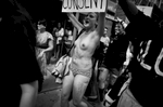 Occupy Wall Street, a leaderless movement, became a magnet for many different causes including violence against women. A woman marches topless to make a statement that even when naked her body is hers and no means no. East Village NYC, 2011. ©2017 Yunghi Kim/ Contact Press Images