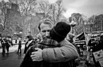FEB 11,  2017. Immigration protest, Washington Square Park, NYC Edward Sullivan in private moment in the midst of immigration protest and street musicians playing piano. 