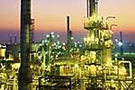 Walking through an oil refinery you can't helpbut think of dinosaurs.Old oil.Old technology.A beautiful place at twilight.