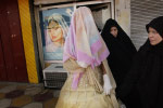 A bride leaves a beauty salon with her face covered; she will not show herself until she reaches the privacy of a family gathering. The Mahdi Army have threatened beauty salon owners advertising pictures of women without their hair covered. Mahdi fighters police neighborhood streets, enforcing strict moral codes. 