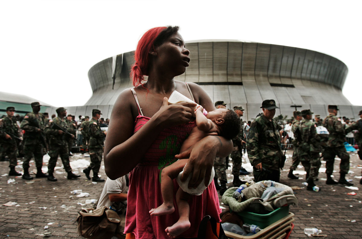 Quintella Willams holds her nine-day-old baby girl, Akea, outside of the Superdome sports complex in New Orleans, LA while waiting to be evacuted from the city.  Thousands of people continued to be left stranded days after Hurricane Katrina devastated the area.