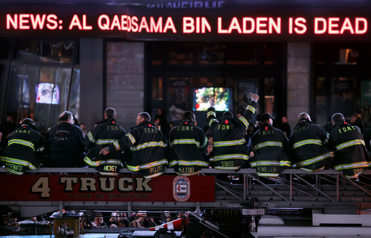 Firefighters from Engine Company 54 and Ladder 4, which share a firehouse in Midtown Manhattan in New York, NY, celebrate together just after midnight in Times Square on May 2, 2011, after it was announced that Osama Bin Laden had been killed in a U.S. military strike in Pakistan.   Fifteen firefighters from the Engine Company 54 and Ladder 4 firehouse died responding to the terrorist attacks on September 11, 2001.    