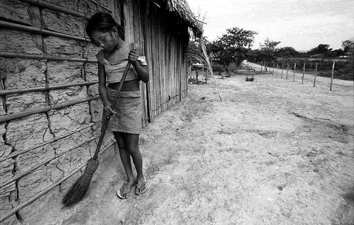 A girl cleaning outside her home inAvierovillage along the Tapajos River.