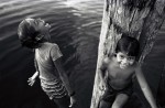 Two girls playing around at a dock along the Tapajos River.