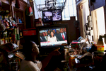 NAT *** Charleston, SC -- 06/22/2015 - A store owner watches Governor Nikki Haley speak about the Confederate flag on television on Monday in Charleston, SC.(Travis Dove for The New York Times)