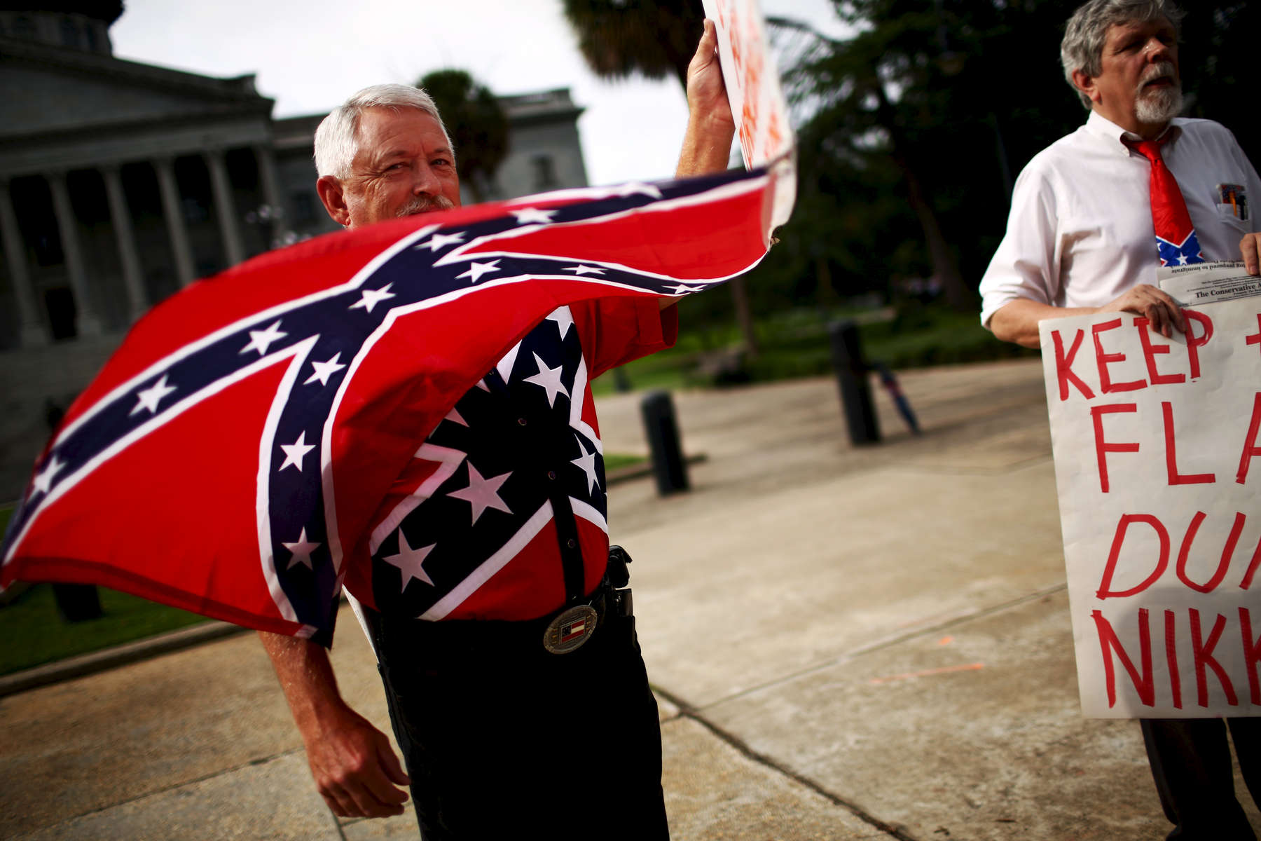 NAT ***Columbia, SC -- 07/06/2015 - Flag supporters outside the state house. South Carolina's legislature takes up the issue of removing the Confederate battle flag from the state house grounds on Monday.  (Travis Dove for The New York Times)