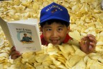Shot on assignment for NATIONAL GEOGRAPHIC WORLD Magazine. A published author at age 10, Nicholas Woo's book was about a subject he really loved..... ..Potato Chips!