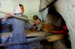 Farzana, 20, breadmaker at a women's bakery in Kabul, Afghanistan. This Bakery was founded by Massouda Jalal, the minister of Women's Affairs.