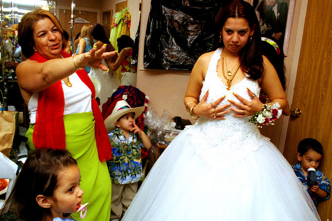 American Gypsy bride getting ready for her wedding ceremony with her mother-in-law in Queens, N.Y.