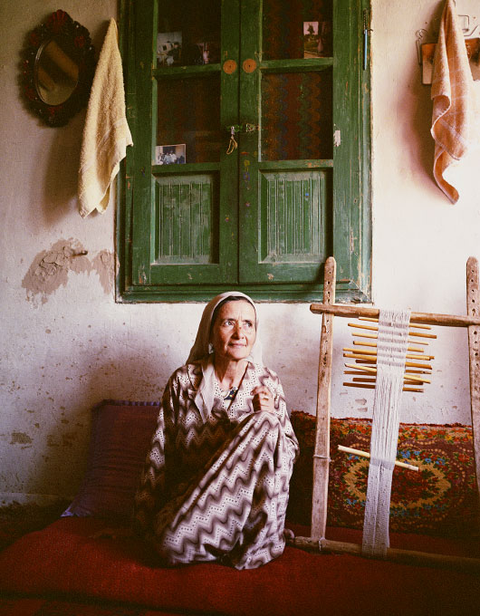 Mahgul, carpet weaver and belt maker. Photographed in her home in Aqcha village, Jawzjan Afghanistan.