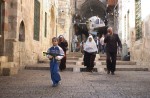 Young Palestinian boy carrying a toy machine gun walks through the street s of the Arab quarter of the Old City in Jerusalem, Israel on November 22, 2005.