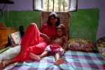 Sex worker and her child at the Sanagachi brothel in Calcutta, India