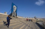 Robina Moqimyar, 17, Olympic Sprinter in the Athens 2004 Olympics stands in the bleachers of the Kabul Olympic Stadium in Kabul, Afghanistan.