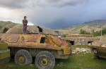 Young Afghan girls playing on an abandoned Soviet tank in Faisabad, Afghanistan. Photographed on June 10, 2005.  Although there has been a large effort to clear Afghanistan of remaining loose weapons they are still littered across the country.
