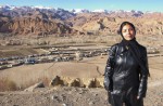 Fatema Kamazamyan, 28 years old, Head of Women's Affairs in Bamiyan, Afghanistan.  Photographed in front of Buddha niches in Bamiyan, Afghanistan.