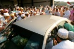 As Dr. Burhanuddin’s car departs the welcoming ceremony at Lawrence Municipal airport, his followers pay their respects and get on last glimpse.