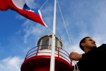 Navy officer Miguel Saez raises the national flag every morning at the Espiritu Santo Lighthouse, situated on a remote tip of Patagonia, Chile.
