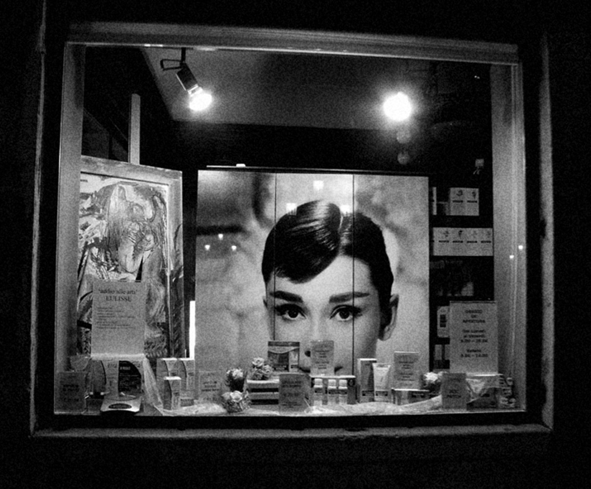 Shop window with Audrey Hepburn photograph.
