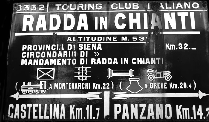 Old metal sign on the side of the road as you drive towards the Chianti region.