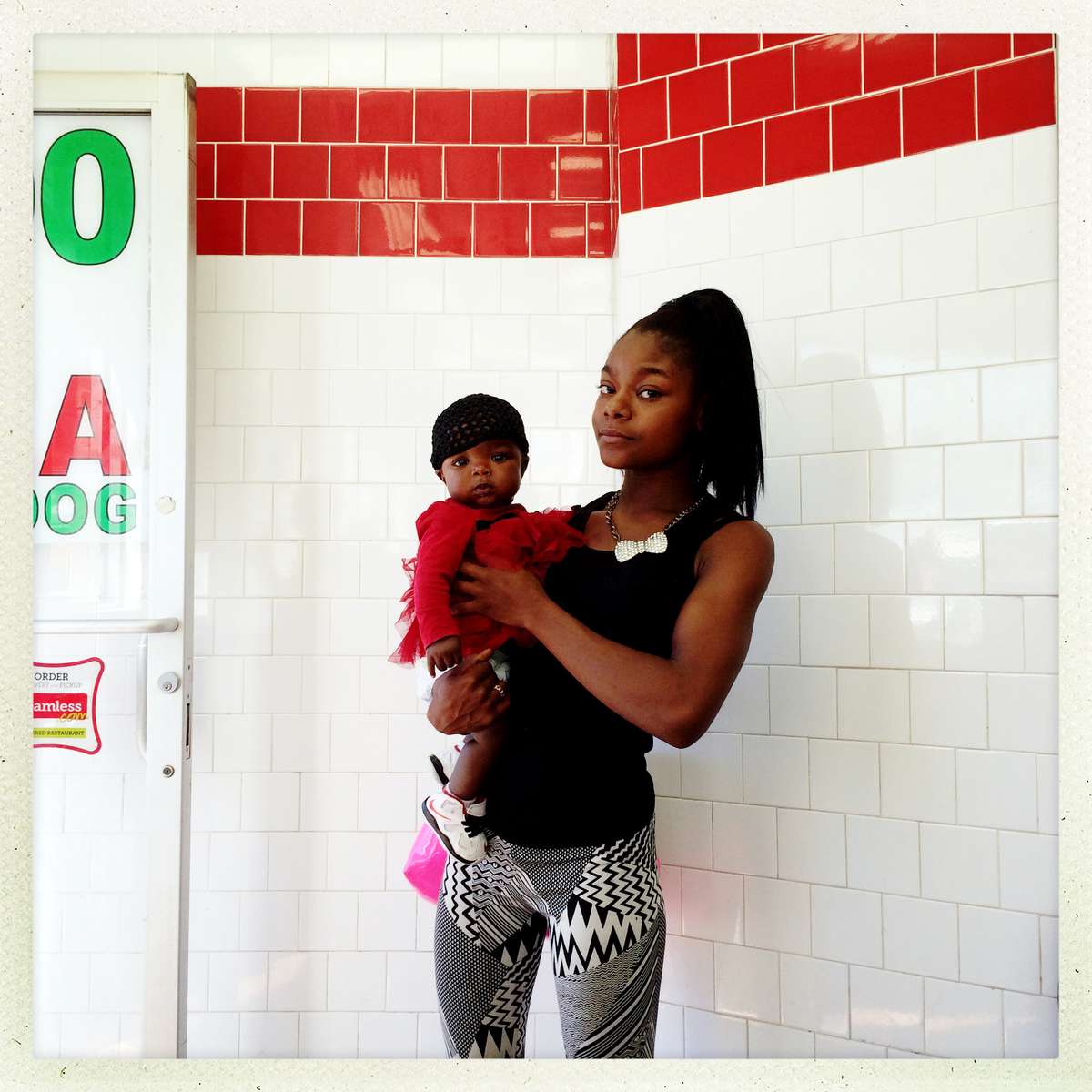 At the Corner: Shay, 23 with her baby