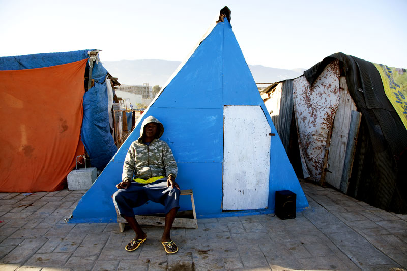 At Pont-Rouge refugee camp, 17 year old Haitian earthquake survivor Thfrere Jean stays at his tent where 8 family members live together. He lost his uncle due to the quake.