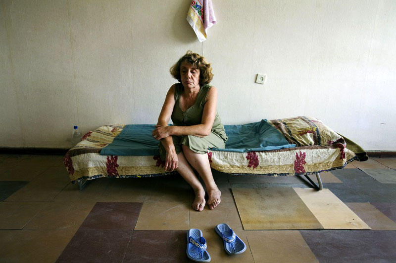 A newly arrived internally displaced person from Garedzvari village of Gori district -- Nana Muradashvili, 37 -- stays at a former Soviet military compound in Tbilisi, the capital of Georgia, as Russian troops continue to occupy large parts of the country. Aug 18, 2008.