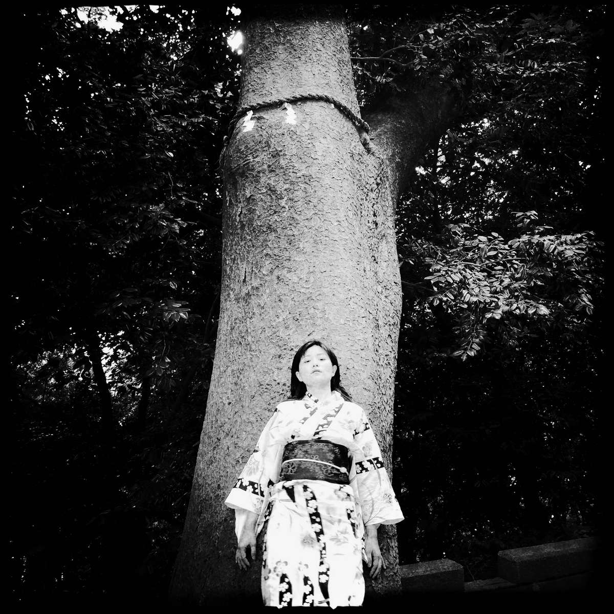 Woman at a holy tree