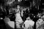 With a snake, an Uighur woman takes an belly  dance performance, that many Uighurs regard as un-Islamic, for Han-Chinses tourists or customers, as Uighurs face hard economic situations, in Urumqi, Xinjiang.
