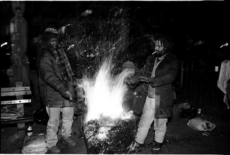 Bon-fire is a way of survival for homeless men in the Park during freezing night. Yet, they have been often forcefully put it out, since it is illegal, and then sometimes resulting in their death. New York, Dec 1989.