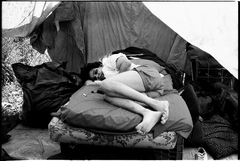 A homeless woman is staying at a bed at an empty lot in Alphabet City. In New York, there is a lack of affordable housing and many homeless do not like to go to shelter due to security and non-privacy reasons. New York, June 1991.