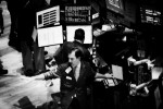 Traders work at the New York Stock Exchange on Friday, the last day of he worst week in at least 75 years at the New York Stock Exchange history. The Dow lost 128 points, giving the blue chips an eight-day loss of just under 2,400, or 22.1 percent. The Dow once fell below 8,000 on Friday, although it was a relatively mild loss at the end. New York, Oct 10 1008.