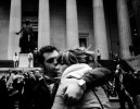 In front of the the New York Stock Exchange Market, a couple hug, as Wall Street suffers through another extraordinary and traumatic session Monday, and people of the Main Street also start to worry about the impact. The Dow Jones industrials plunged as much as 800 points -- their largest one-day point drop -- before recovering to close with a loss of 370, resulting in the Dow below 10,000 for the first time in four years, despite the US and other states’ government efforts to contain the fast-spreading financial crisis. New York, Oct 06 2008.
