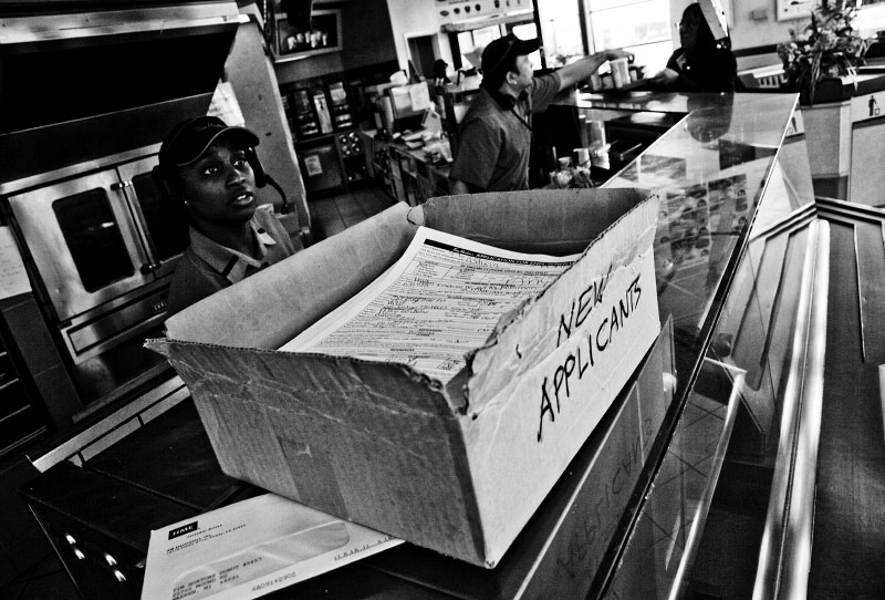 A box fully with new applicants' job application forms is put at a counter in a franchised fast food restaurant, as the unemployment rate is very high in Detroit.